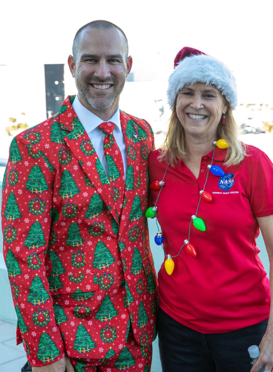 Kennedy Space Center Director Janet Petro, right, poses with Kennedy employee Jerad Merbitz at the 2022 Center Director’s Holiday Coffee on Dec. 7, 2022, at NASA’s Kennedy Space Center in Florida. The annual holiday event is an opportunity for Kennedy employees and NASA retirees to exchange holiday greetings with center leaders and fellow support staff.
