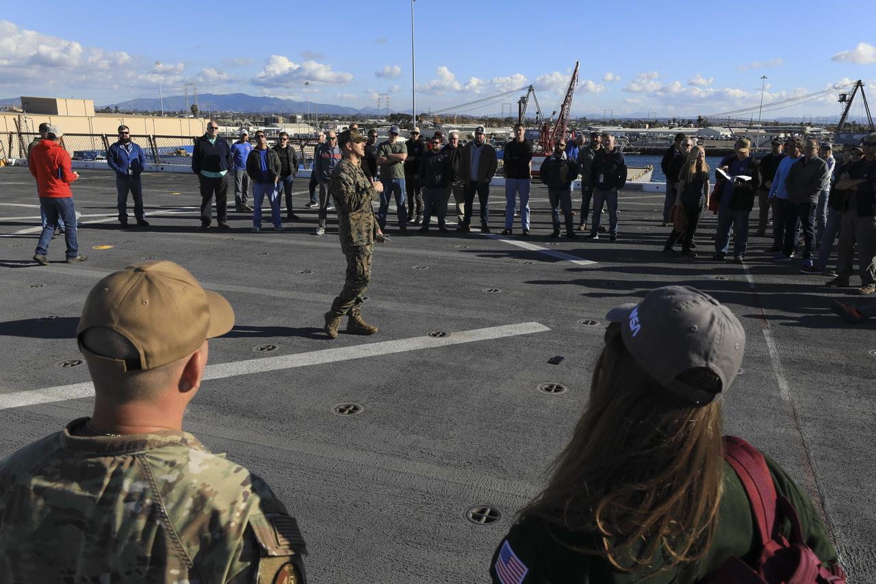 NASA and DOD members of the Artemis I recovery team listen to a safety briefing before going underway aboard the USS Portland (LPD 27). The team heads out to sea ahead of the Dec. 11 Orion splashdown in the Pacific Ocean. 