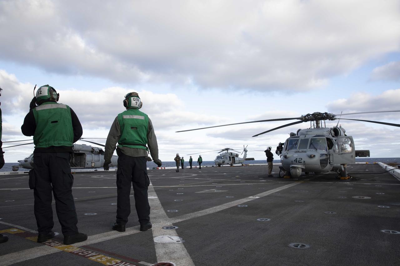 NASA and DoD members of the Artemis I recovery team run practice flight operations procedures aboard the USS Portland (LPD 27). The team is out at sea ahead of the Dec. 11 Orion splashdown in the Pacific Ocean.