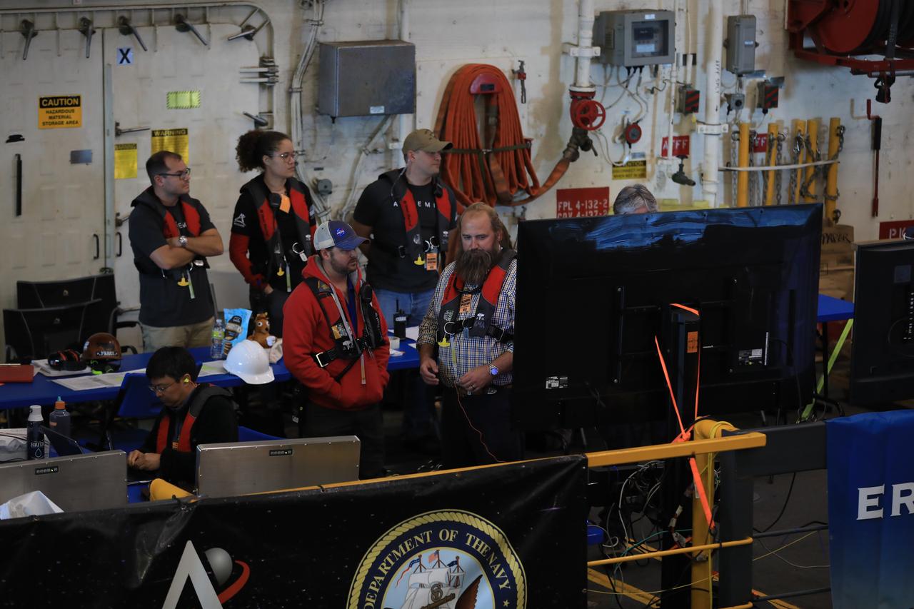 Members of NASA's Landing and Recovery Team, the U.S. Navy and the Department of Defense help bring NASA's Orion spacecraft inside the well deck of the USS Portland on Dec. 11, 2022 2022 off the coast of Baja California. After launching atop the Space Launch System rocket on Nov. 16, 2022 from the agency’s Kennedy Space Center in Florida, Orion spent 25.5 days in space before returning to Earth, completing the Artemis I mission.