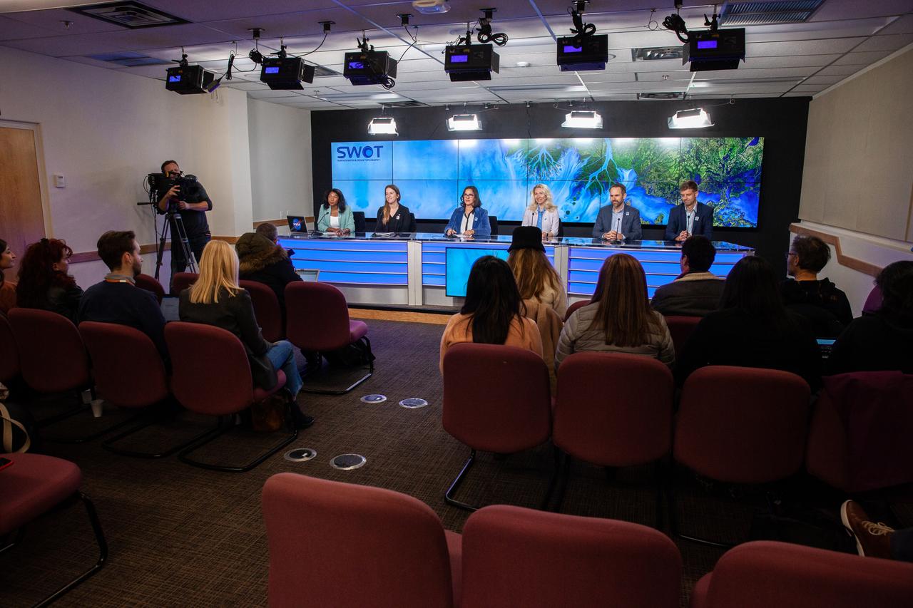 NASA and the French space agency Centre National d’Études Spatiales (CNES) hold a science briefing on the Surface Water and Ocean Topography (SWOT) mission on Dec. 13, 2022, at Vandenberg Space Force Base in California. Participating from left are Katherine Calvin, chief scientist and senior climate advisor, NASA; Selma Cherchali, Earth observation program head, CNES; Nadya Vinogradova Shiffer, SWOT program scientist, NASA; Tamlin Pavelsky, SWOT hydrology science lead, University of North Carolina; Benjamin Hamlington, research scientist, Sea Level and Ice Group, Jet Propulsion Laboratory. SWOT is scheduled to launch on a SpaceX Falcon 9 rocket from Space Launch Complex-4 East at Vandenberg on Dec. 15, 2022, at 3:46 a.m. PST. SWOT will be NASA’s first global survey of nearly all water on Earth’s surface. Scientists plan to use its observations to better understand the global water cycle, furnish insight into the ocean’s role in how climate change unfolds, and provide a global inventory of water resources. The SWOT mission is a collaborative effort between NASA and CNES with contributions from the Canadian Space Agency and the UK Space Agency. NASA’s Launch Services Program, based at the agency’s Kennedy Space Center in Florida, is managing the launch service.