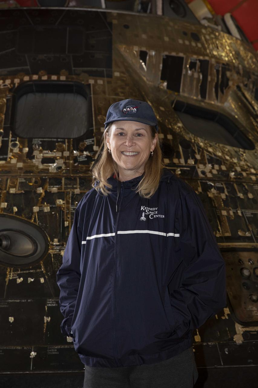 Kennedy Space Center Director Janet Petro stands near the Artemis I Orion spacecraft inside the well deck of the USS Portland at U.S. Naval Base San Diego on Dec. 13, 2022. The Orion spacecraft is secured inside the well deck after splashing down at 12:40 p.m. EST on Dec. 11, 2022. U.S. Navy divers helped recover the Orion spacecraft. NASA, the Navy and other Department of Defense partners worked together to secure the spacecraft inside the ship’s well deck approximately five hours after Orion splashed down in the Pacific Ocean off the coast of Baja, California. 
