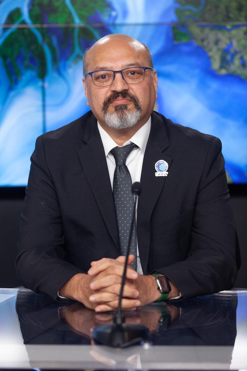 Parag Vaze, SWOT project manager, Jet Propulsion Laboratory, participates in a prelaunch news conference held by NASA, SpaceX, and the French space agency Centre National d’Études Spatiales (CNES) for the Surface Water and Ocean Topography (SWOT) mission on Dec. 14, 2022, at Vandenberg Space Force Base in California. SWOT is scheduled to launch on a SpaceX Falcon 9 rocket from Space Launch Complex-4 East at Vandenberg on Dec. 15, 2022, at 3:46 a.m. PST. SWOT will be NASA’s first global survey of nearly all water on Earth’s surface. Scientists plan to use its observations to better understand the global water cycle, furnish insight into the ocean’s role in how climate change unfolds, and provide a global inventory of water resources. The SWOT mission is a collaborative effort between NASA and CNES with contributions from the Canadian Space Agency and the UK Space Agency. NASA’s Launch Services Program, based at the agency’s Kennedy Space Center in Florida, is managing the launch service.