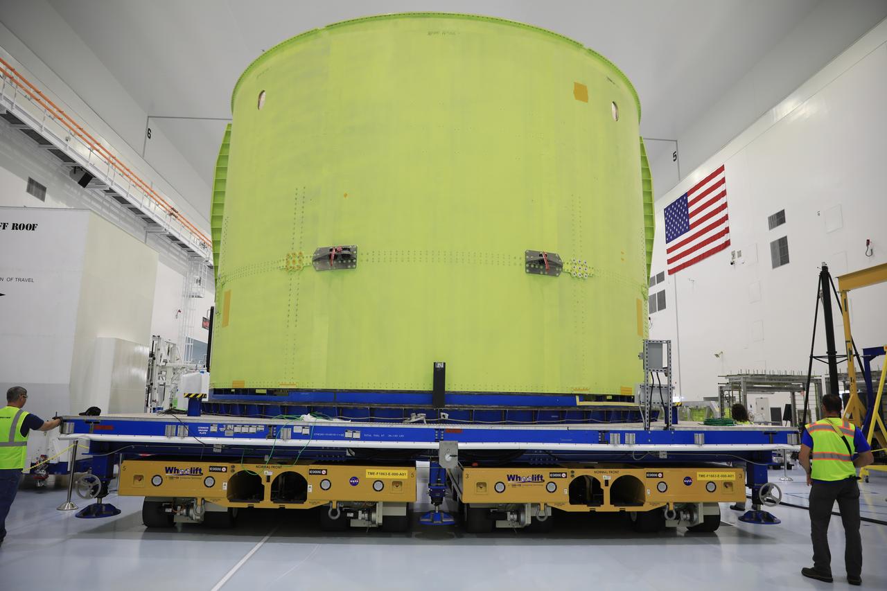 The engine section of the Space Launch System rocket’s core stage for NASA’s Artemis III mission is moved on a work stand into the high bay of the Space Station Processing Facility (SSPF) at NASA’s Kennedy Space Center in Florida on Dec. 15, 2022. The section was shipped from Michoud Assembly Facility in New Orleans on Dec. 10, 2022 aboard the Pegasus barge, was offloaded, and transferred to the SSPF. Teams will begin processing operations ahead of final integration in the Vehicle Assembly Building. Artemis III will send astronauts, including the first woman and first person of color, on a mission aboard the Orion spacecraft to the surface of the Moon. 