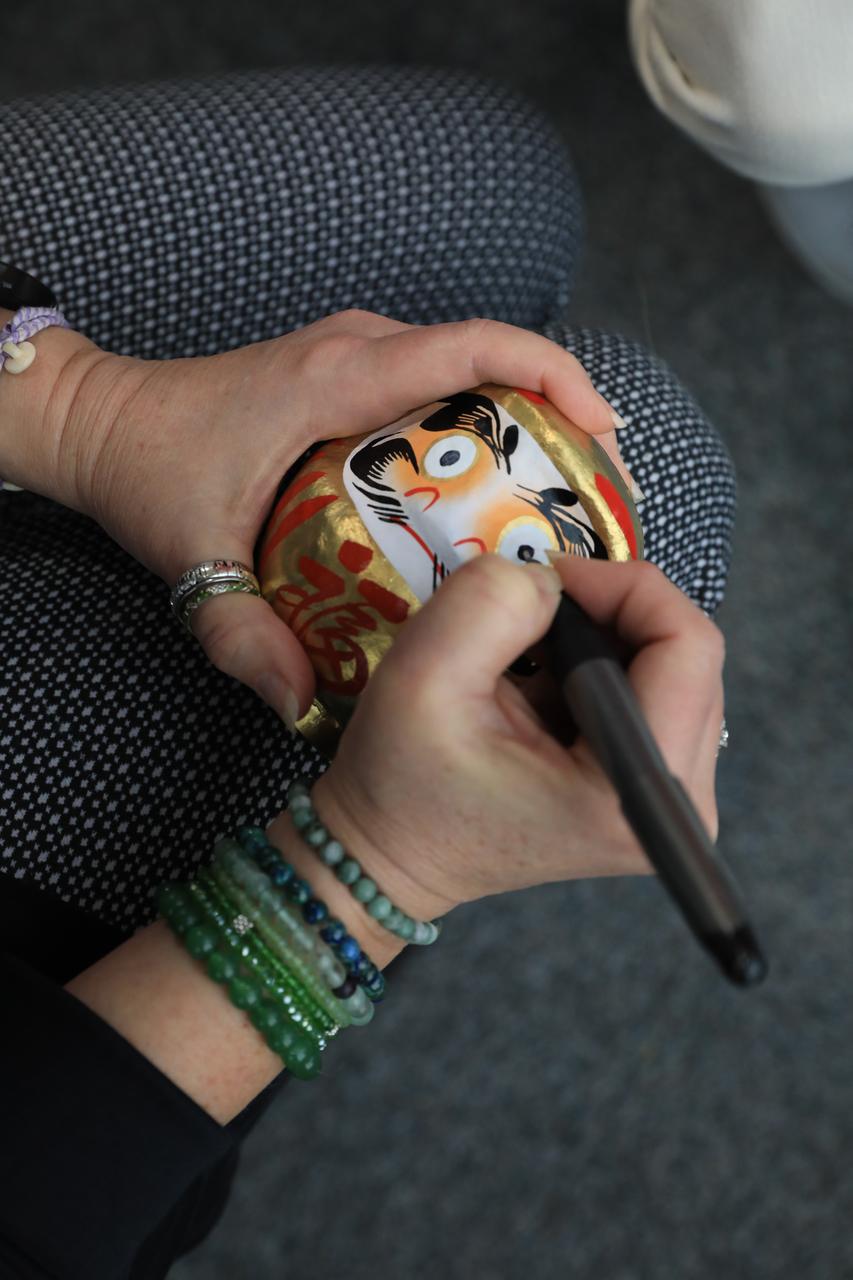 Artemis launch director, Charlie Blackwell-Thompson and associate administrator of NASA’s Space Operations Mission Directorate, Kathryn Lueders finish coloring in the other eye of the Japanese Daruma doll to highlight the successful Artemis I mission on Dec. 20, 2022 in Firing Room 1 of the Rocco A. Petrone Launch Control Center at NASA’s Kennedy Space Center in Florida. The Japan Aerospace Exploration Agency gave a Daruma doll to both Lueders and associate administrator for the Exploration Systems Development Mission Directorate, Jim Free as a token of good luck prior to the Artemis I launch. Free filled in his eye on Dec. 11, 2022, with Artemis I Ascent and Entry Flight Director Judd Frieling in Mission Control Center at NASA’s Johnson Space Center in Houston, Texas.