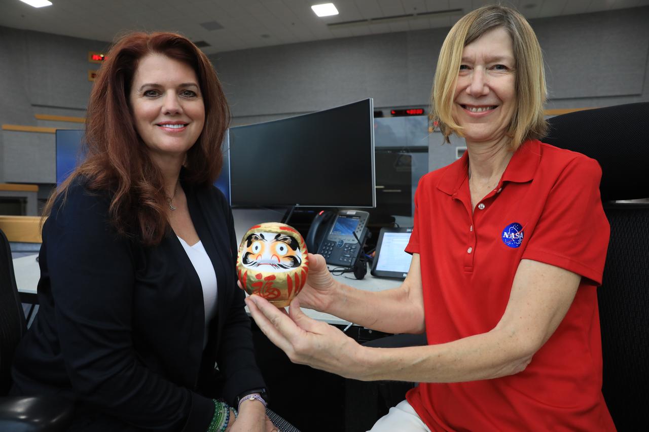 Artemis launch director, Charlie Blackwell-Thompson and associate administrator of NASA’s Space Operations Mission Directorate, Kathryn Lueders finish coloring in the other eye of the Japanese Daruma doll to highlight the successful Artemis I mission on Dec. 20, 2022 in Firing Room 1 of the Rocco A. Petrone Launch Control Center at NASA’s Kennedy Space Center in Florida. The Japan Aerospace Exploration Agency gave a Daruma doll to both Lueders and associate administrator for the Exploration Systems Development Mission Directorate, Jim Free as a token of good luck prior to the Artemis I launch. Free filled in his eye on Dec. 11, 2022, with Artemis I Ascent and Entry Flight Director Judd Frieling in Mission Control Center at NASA’s Johnson Space Center in Houston, Texas.