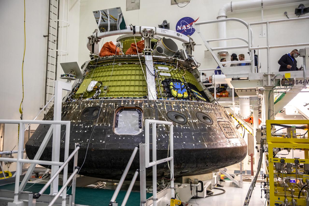 NASA’s Artemis I Orion capsule is secured on a platform inside the Multi-Payload Processing Facility (MPPF) at Kennedy Space Center in Florida on Jan. 6, 2023. Orion splashed down in the Pacific Ocean at 12:40 p.m. EST on Dec. 11, 2022. The spacecraft was secured inside the well deck of the USS Portland for the voyage to U.S. Naval Base Sand Diego, arriving on Dec. 13, 2022. Orion was offloaded and transported back to Kennedy for deservicing inside the MPPF. Orion launched atop the Space Launch System rocket on Nov. 16, 2022 at 1:47 a.m. EST from Kennedy’s Launch Complex 39B for a 25-day trip beyond the Moon and back. During the flight, Orion flew farther than any human-rated spacecraft has ever flown, paving the way for human deep space exploration and demonstrating NASA’s commitment and capability to extend human presence to the Moon and beyond. 