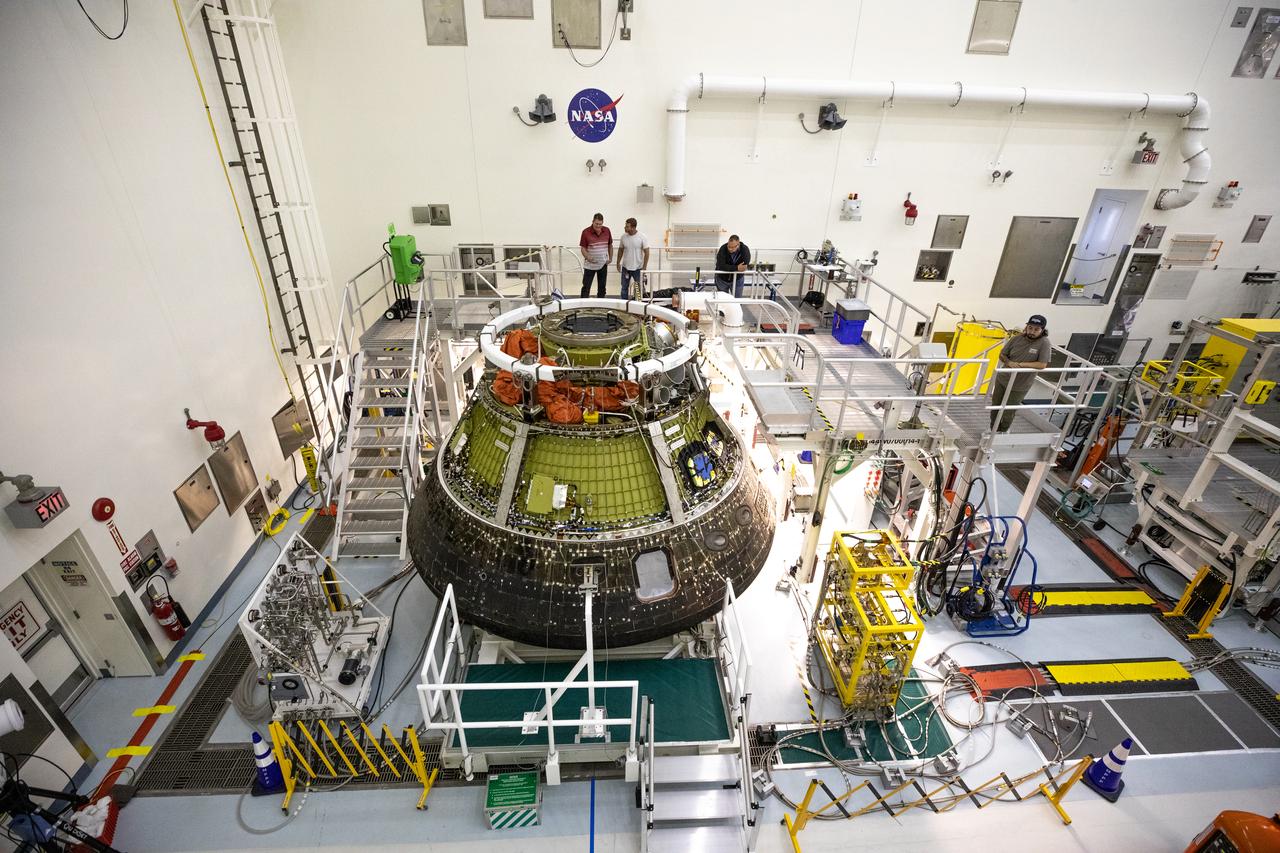 A view from above shows NASA’s Artemis I Orion capsule secured on a platform inside the Multi-Payload Processing Facility (MPPF) at Kennedy Space Center in Florida on Jan. 6, 2023. Orion splashed down in the Pacific Ocean at 12:40 p.m. EST on Dec. 11, 2022. The spacecraft was secured inside the well deck of the USS Portland for the voyage to U.S. Naval Base Sand Diego, arriving on Dec. 13, 2022. Orion was offloaded and transported back to Kennedy for deservicing inside the MPPF. Orion launched atop the Space Launch System rocket on Nov. 16, 2022 at 1:47 a.m. EST from Kennedy’s Launch Complex 39B for a 25-day trip beyond the Moon and back. During the flight, Orion flew farther than any human-rated spacecraft has ever flown, paving the way for human deep space exploration and demonstrating NASA’s commitment and capability to extend human presence to the Moon and beyond. 