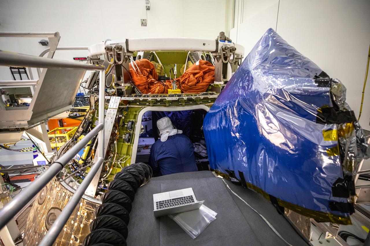 A technician unpacks NASA’s Artemis I Orion capsule inside the Multi-Payload Processing Facility (MPPF) at Kennedy Space Center in Florida on Jan. 6, 2023. Orion splashed down in the Pacific Ocean at 12:40 p.m. EST on Dec. 11, 2022. The spacecraft was secured inside the well deck of the USS Portland for the voyage to U.S. Naval Base Sand Diego, arriving on Dec. 13, 2022. Orion was offloaded and transported back to Kennedy for deservicing inside the MPPF. Orion launched atop the Space Launch System rocket on Nov. 16, 2022 at 1:47 a.m. EST from Kennedy’s Launch Complex 39B for a 25-day trip beyond the Moon and back. During the flight, Orion flew farther than any human-rated spacecraft has ever flown, paving the way for human deep space exploration and demonstrating NASA’s commitment and capability to extend human presence to the Moon and beyond. 