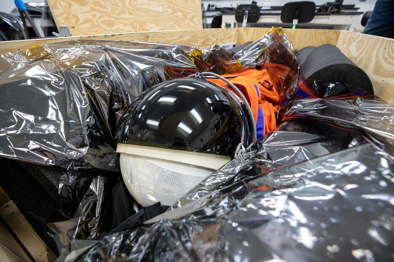Commander Moonikin Campos, a sensored stand-in for humans from NASA’s Artemis I mission, is packed within its transport crate inside the Space Station Processing Facility at Kennedy Space Center in Florida on Jan. 10, 2023, for its trip back to NASA’s Johnson Space Center in Houston. Moonikin Campos was secured inside the Orion spacecraft for the mission beyond the Moon and back to Earth. Artemis I Orion launched atop the Space Launch System (SLS) rocket from Kennedy’s Launch Complex 39B on Nov. 16, 2022, at 1:47 a.m. EST for a 25-day trip beyond the Moon and back. During the flight, Orion flew farther than any human-rated spacecraft has ever flown, paving the way for human deep space exploration and demonstrating NASA’s commitment and capability to extend human presence to the Moon and beyond. The primary goal of Artemis I was to thoroughly test the SLS and Orion spacecraft’s integrated systems before crewed missions. Under Artemis, NASA aims to land the first woman and first person of color on the Moon and establish sustainable lunar exploration. 