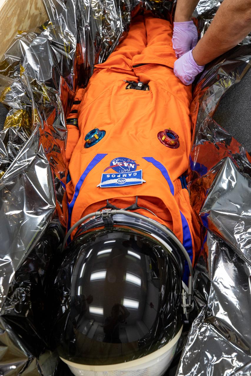 Commander Moonikin Campos, a sensored stand-in for humans from NASA’s Artemis I mission, is packed within its transport crate inside the Space Station Processing Facility at Kennedy Space Center in Florida on Jan. 10, 2023, for its trip back to NASA’s Johnson Space Center in Houston. Moonikin Campos was secured inside the Orion spacecraft for the mission beyond the Moon and back to Earth. Artemis I Orion launched atop the Space Launch System (SLS) rocket from Kennedy’s Launch Complex 39B on Nov. 16, 2022, at 1:47 a.m. EST for a 25-day trip beyond the Moon and back. During the flight, Orion flew farther than any human-rated spacecraft has ever flown, paving the way for human deep space exploration and demonstrating NASA’s commitment and capability to extend human presence to the Moon and beyond. The primary goal of Artemis I was to thoroughly test the SLS and Orion spacecraft’s integrated systems before crewed missions. Under Artemis, NASA aims to land the first woman and first person of color on the Moon and establish sustainable lunar exploration. 