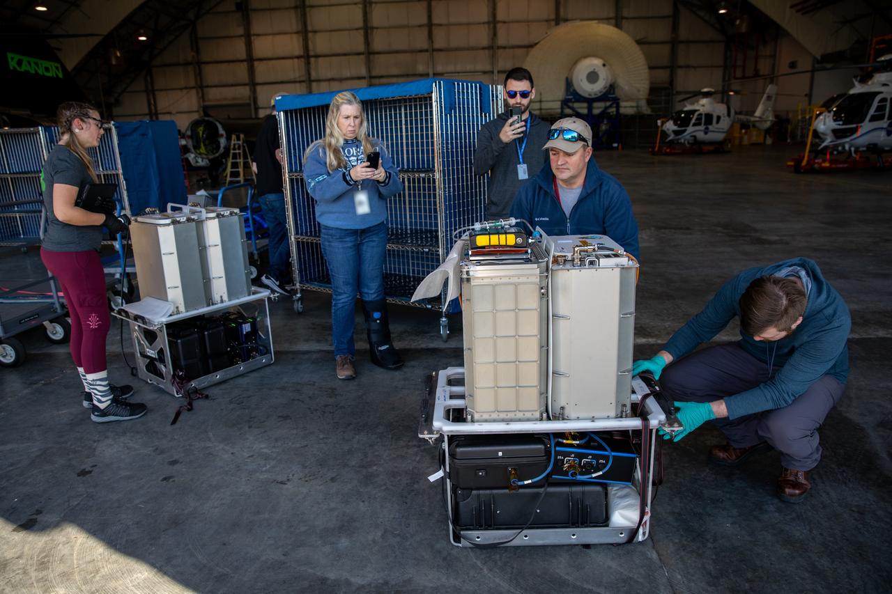 Technicians at the Launch and Landing Facility at NASA’s Kennedy Space Center in Florida receive scientific research samples for processing at the spaceport’s Space Station Processing Facility on Jan. 11, 2023. The experiments returned to Earth on SpaceX's 26th commercial resupply services mission, which launched from Kennedy’s Pad 39A at 2:20 p.m. EST on Nov. 26, 2022, making its successful parachute-assisted splashdown west of Tampa in the Gulf of Mexico, at 5:19 a.m. EST on Jan. 11. The SpaceX cargo Dragon returned approximately 4,400 pounds of scientific experiments and other cargo from the International Space Station. Splashing down off the coast of Florida enables quick transportation of the experiments, allowing SpaceX to retrieve Dragon and offload time-sensitive research cargo to pack on an Airbus H225 helicopter for delivery to Kennedy just hours later. Some of the scientific investigations that Dragon returned include those on deep space radiation protection, hydroponic and aeroponic plants, and bioprospecting, which is identifying plants and animals that may contain substances with potential for use as drugs, biochemicals, and more.