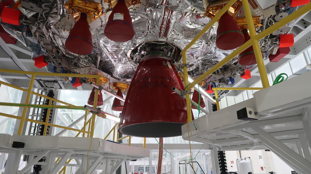 Technicians at NASA’s Kennedy Space Center in Florida finish installing the orbital maneuvering system engine nozzle and heat shield for the Artemis II European Service Module inside the Neil Armstrong Operations and Checkout Building on Jan. 16, 2023. Artemis II will be the first crewed flight test of the Space Launch System rocket and Orion spacecraft. The service module will provide the power necessary to propel Orion on a trip around the Moon, including the in-space maneuvering capability and other commodities necessary to sustain crew for the duration of the mission.