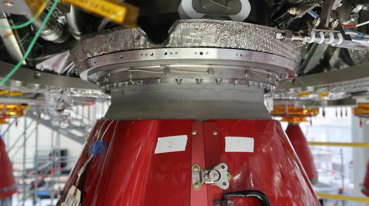 In view is a closeup of the newly installed orbital maneuvering system engine nozzle and heat shield for the Artemis II European Service Module inside the Neil Armstrong Operations and Checkout Building at NASA’s Kennedy Space Center in Florida on Jan. 16, 2023. Artemis II will be the first crewed flight test of the Space Launch System rocket and Orion spacecraft. The service module will provide the power necessary to propel Orion on a trip around the Moon, including the in-space maneuvering capability and other commodities necessary to sustain crew for the duration of the mission.