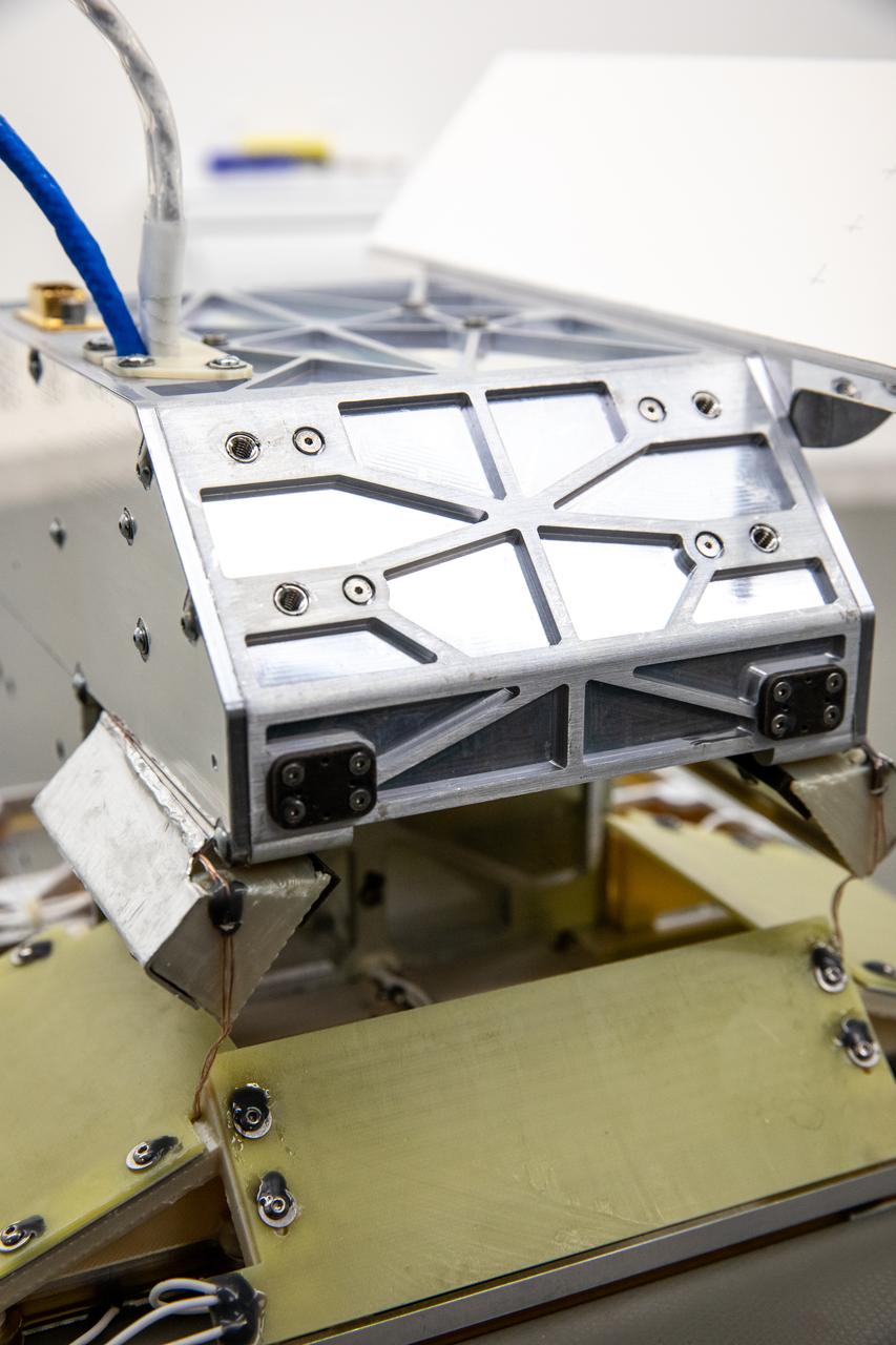 Inside of the Electrostatics and Surface Physics Laboratory at NASA’s Kennedy Space Center in Florida, an electrodynamic dust shield (EDS) is in view on Jan. 18, 2023. The dust shield is one of the payloads that will fly aboard Firefly Aerospace’s Blue Ghost lunar lander as part of NASA’s Commercial Lunar Payload Services (CLPS) initiative. During the mission, EDS will generate a non-uniform electric field using varying high voltage on multiple electrodes. This traveling field, in turn, carries away the particles and has potential applications in thermal radiators, spacesuit fabrics, visors, camera lenses, solar panels, and many other technologies. The CLPS initiative is a key part of NASA’s Artemis lunar exploration efforts. The science and technology payloads sent to the Moon’s surface as part of the initiative will help lay the foundation for human missions and a sustainable human presence on the lunar surface. 