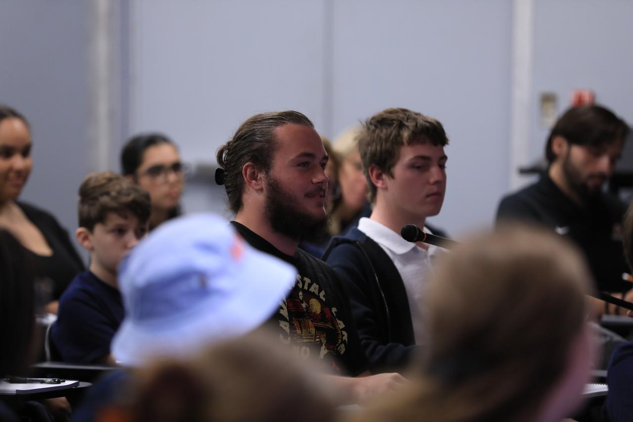 As part of NASA’s NextGen STEM project, students from Florida’s St. Cloud High School and Storm Grove Middle School in Vero Beach participate in an Artemis I student media briefing inside the John Holliman Auditorium of the News Center at NASA’s Kennedy Space Center in Florida on Jan. 19, 2023. Along with the students participating in person, middle and high school students across the country had the opportunity to ask questions of the panel via phone to discuss the Artemis I mission and the agency’s future of human space exploration.