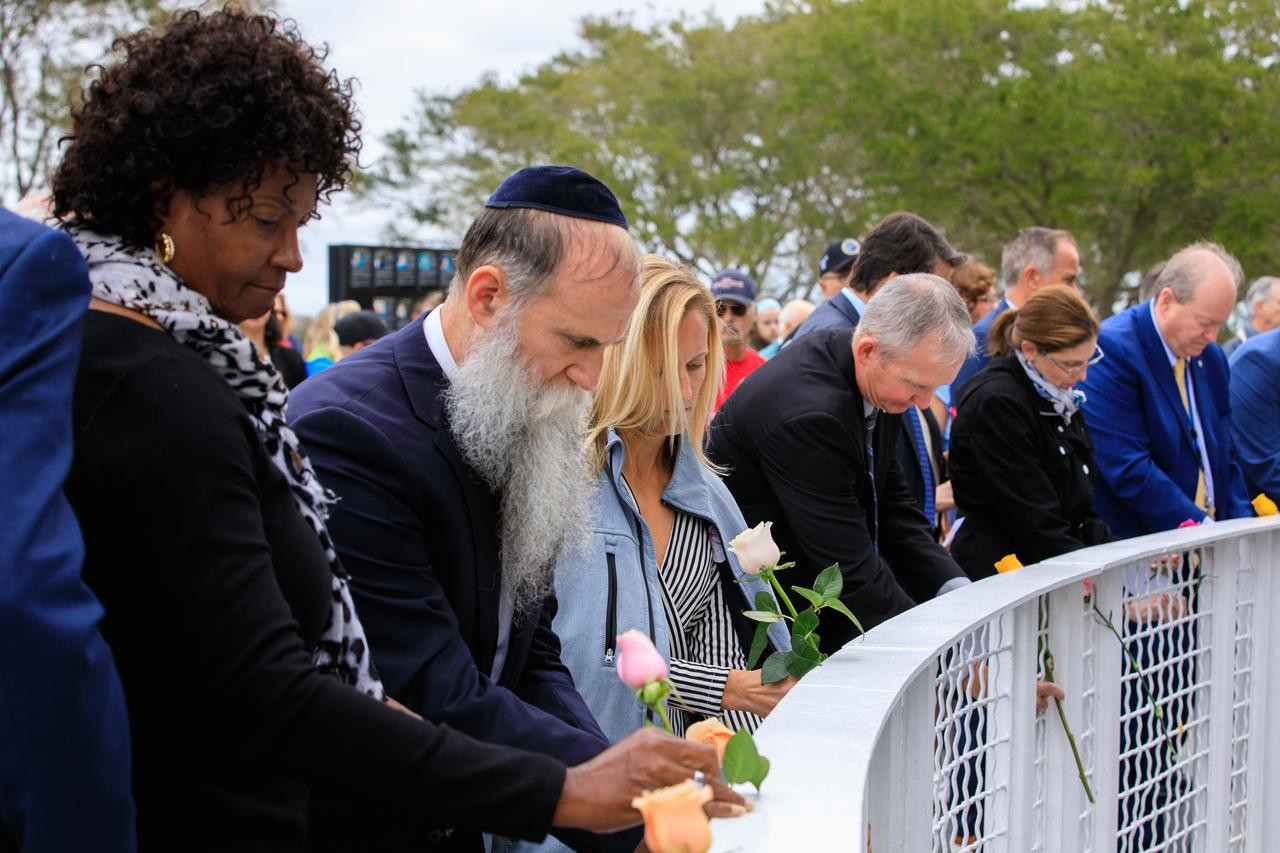 Kennedy Space Center workers and guests place flowers at the Space Mirror Memorial at the Kennedy Space Center Visitor Complex in Florida during the Day of Remembrance on Jan. 26, 2023. The event honored the crews of Apollo 1 and space shuttles Challenger and Columbia, as well as other astronauts who lost their lives in the pursuit of spaceflight. This year marks the 20th anniversary of the Columbia tragedy. This year’s ceremony was hosted by the Astronauts Memorial Foundation, which was founded after the shuttle Challenger accident in 1986 to honor the sacrifices of fallen astronauts each year. 