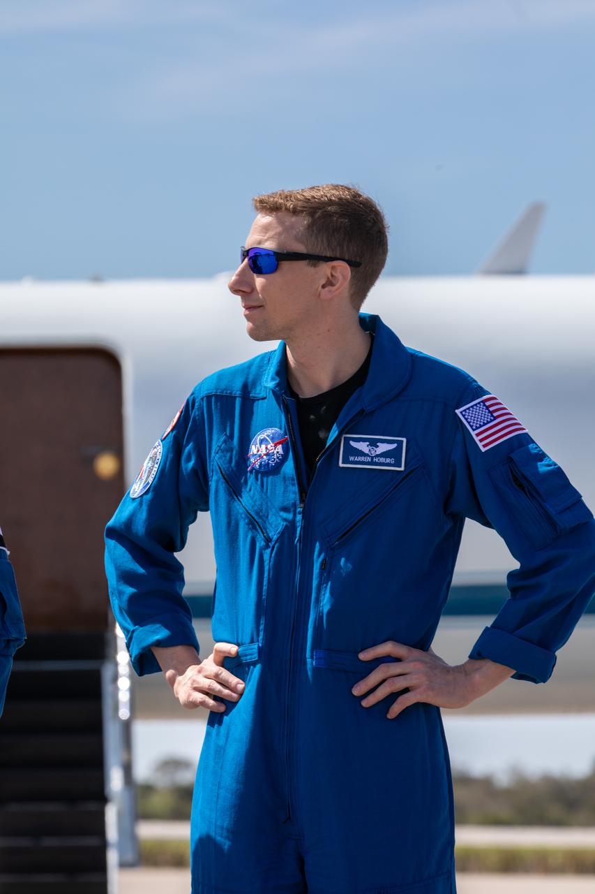 NASA astronaut Warren “Woody” Hoburg speaks to members of the news media during crew arrival for NASA’s SpaceX Crew-6 mission at Kennedy Space Center’s Launch and Landing Facility in Florida on Feb. 21, 2023. Hoburg, along with NASA astronaut Stephen Bowen, UAE (United Arab Emirates) astronaut Sultan Alneyadi, and Roscosmos cosmonaut Andrey Fedyaev will launch to the International Space Station aboard the Crew Dragon on a SpaceX Falcon 9. Launch is targeted for no earlier than Feb. 26 at 2:07 a.m. EST from Launch Complex 39A. Crew-6 is the sixth crew rotation mission with SpaceX to the station, and the seventh flight of Dragon with people as part of the agency’s Commercial Crew Program. 