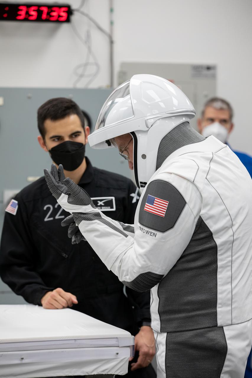 NASA astronaut and SpaceX Crew-6 commander Stephen Bowen checks his gloves inside the crew suit-up room in the Neil Armstrong Operations and Checkout Building at NASA’s Kennedy Space Center in Florida during a countdown dress rehearsal on Feb. 23, 2023. Bowen, along with NASA astronaut Warren “Woody” Hoburg, pilot; Andrei Fedyaev, Roscosmos cosmonaut and mission specialist; and Sultan Alneyadi, UAE (United Arab Emirates) astronaut and mission specialist will launch to the International Space Station aboard the Crew Dragon Endeavour on a SpaceX Falcon 9. Launch is targeted for 1:45 a.m. EST on Feb. 27 from Launch Complex 39A. Crew-6 is the sixth crew rotation mission with SpaceX to the station, and the seventh flight of Dragon with people as part of the agency’s Commercial Crew Program. 