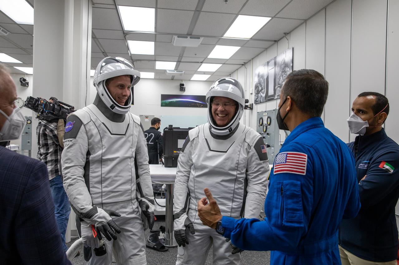 From left, Andrei Fedyaev, Roscosmos cosmonaut and mission specialist for Crew-6, and NASA astronaut Stephen Bowen, commander, share some humor inside the crew suit-up room in the Neil Armstrong Operations and Checkout Building at NASA’s Kennedy Space Center in Florida during a countdown dress rehearsal on Feb. 23, 2023, to prepare for the upcoming Crew-6 launch. The Crew-6 astronauts will launch to the International Space Station aboard the Crew Dragon Endeavour on a SpaceX Falcon 9. Launch is targeted for 1:45 a.m. EST on Feb. 27 from Launch Complex 39A. Crew-6 is the sixth crew rotation mission with SpaceX to the station, and the seventh flight of Dragon with people as part of the agency’s Commercial Crew Program.