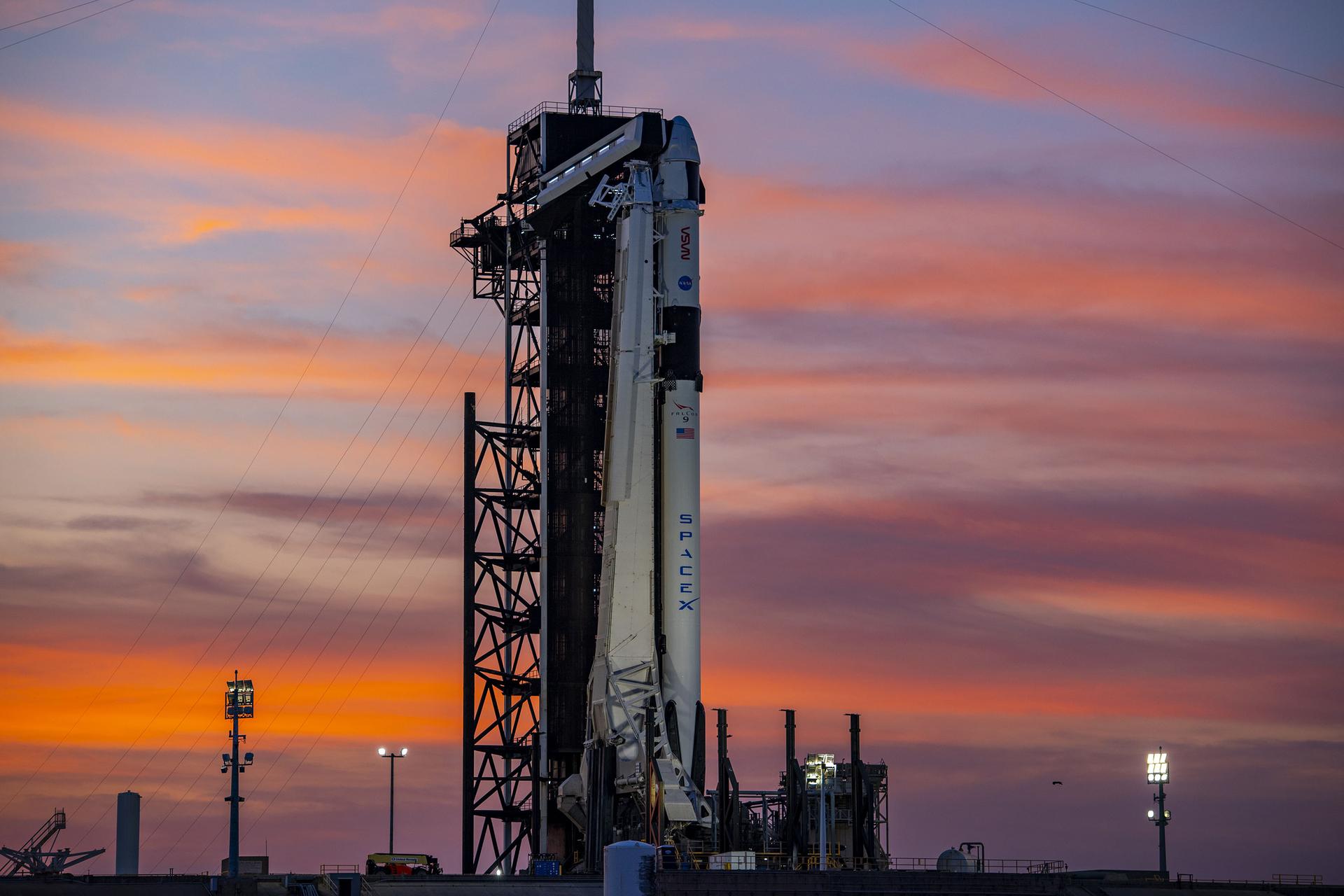 A colorful sunset serves as the backdrop for SpaceX’s Falcon 9 rocket and Dragon spacecraft Endeavour on the pad at Launch Complex 39A at Kennedy Space Center in Florida on Feb. 23, 2023, for NASA’s SpaceX Crew-6 mission. The crew access arm has been moved into position at the Dragon spacecraft. NASA astronauts Stephen Bowen, spacecraft commander, and Warren “Woody” Hoburg, pilot, along with mission specialists Sultan Alneyadi, UAE (United Arab Emirates) astronaut, and Andrei Fedyaev, Roscosmos cosmonaut, are slated to launch to the International Space Station at 1:45 a.m. EST on Feb. 27 from Launch Complex 39A. Crew-6 is the sixth crew rotation mission with SpaceX to the station, and the seventh flight of Dragon with people as part of the agency’s Commercial Crew Program.