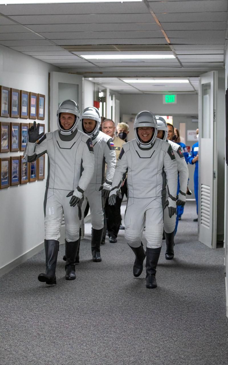 NASA’s SpaceX Crew-6 astronauts walk down the hallway from the astronaut crew quarters to the elevator in the Neil Armstrong Operations and Checkout Building at NASA’s Kennedy Space Center in Florida on Feb. 26, 2023. In front, from left are NASA astronaut Warren “Woody” Hoburg, pilot; and NASA astronaut Stephen Bowen, spacecraft commander. Behind them, from left are Andrey Fedyaev, Roscosmos cosmonaut and mission specialist; and Sultan Alneyadi, UAE (United Arab Emirates) astronaut and mission specialist. The astronauts are preparing for their launch to the International Space Station aboard SpaceX’s Dragon spacecraft atop the Falcon 9 rocket. Launch was targeted for 1:45 a.m. EST on Feb. 27 from Launch Complex 39A, but was scrubbed for the day. Crew-6 is the sixth crew rotation mission with SpaceX to the station, and the seventh flight of Dragon with people as part of the agency’s Commercial Crew Program.