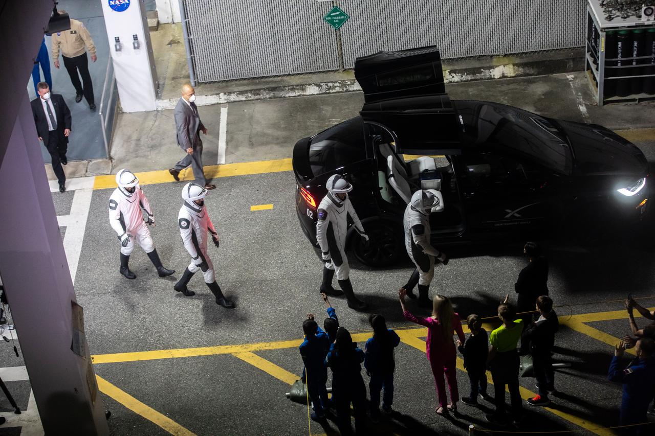 In view outside the Neil Armstrong Operations and Checkout Building at NASA’s Kennedy Space Center in Florida on Feb. 26, 2023, is one of two Tesla vehicles that will transport NASA’s SpaceX Crew-6 astronauts to Launch Complex 39A for launch to the International Space Station. Crew-6 astronauts, from the right are NASA astronaut Stephen Bowen, spacecraft commander; NASA astronaut Warren “Woody” Hoburg, pilot; Andrey Fedyaev, Roscosmos cosmonaut and mission specialist; and Sultan Alneyadi, UAE (United Arab Emirates) astronaut and mission specialist. Launch was targeted for 1:45 a.m. EST on Feb. 27 from Launch Complex 39A, but was scrubbed for the day. Crew-6 is the sixth crew rotation mission with SpaceX to the station, and the seventh flight of Dragon with people as part of the agency’s Commercial Crew Program. 