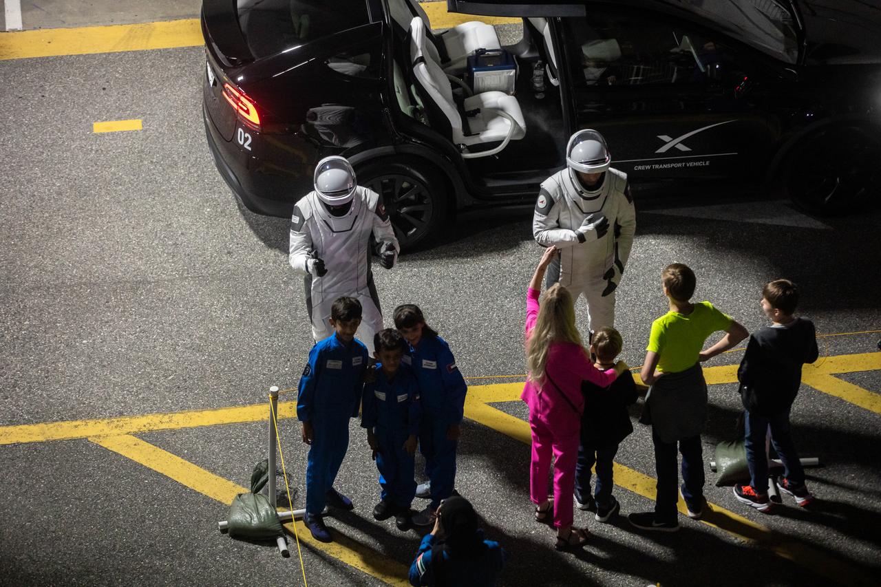 NASA’s SpaceX Crew-6 astronauts greet their family members after walking out of the Neil Armstrong Operations and Checkout Building at the agency’s Kennedy Space Center in Florida on Feb. 26, 2023. From left are Sultan Alneyadi, UAE (United Arab Emirates) astronaut and mission specialist; and Andrey Fedyaev, Roscosmos cosmonaut and mission specialist. They will board one of the Tesla vehicles for the trip to Kennedy’s Launch Complex 39A, where they will launch to the International Space Station aboard SpaceX’s Dragon Endeavour spacecraft atop the Falcon 9 rocket. Launch was targeted for 1:45 a.m. EST on Feb. 27 from Launch Complex 39A, but was scrubbed for the day. Crew-6 is the sixth crew rotation mission with SpaceX to the station, and the seventh flight of Dragon with people as part of the agency’s Commercial Crew Program. 