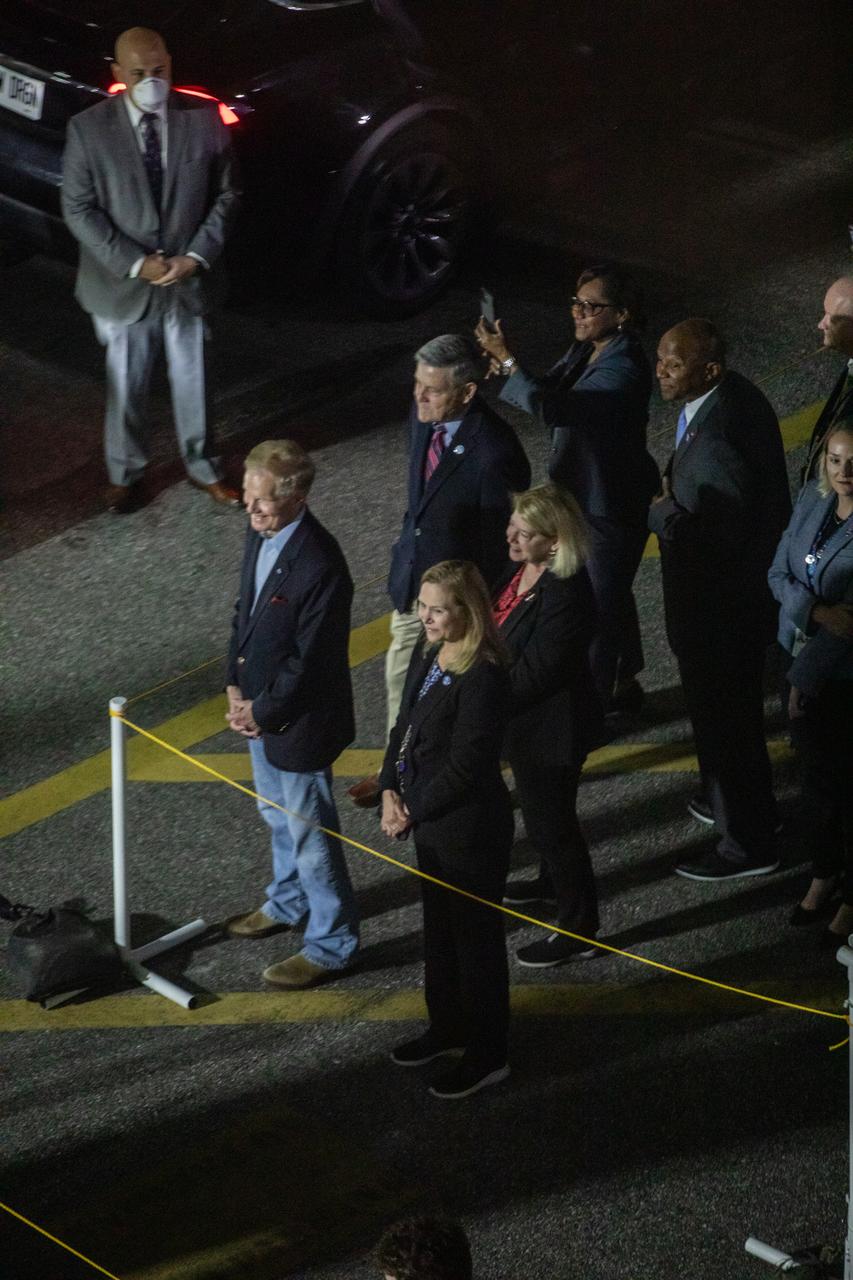 NASA Administrator Bill Nelson, in front, left, along with Kennedy Space Center Director Janet Petro, wait to greet NASA’s SpaceX Crew-6 crewmembers as they exit the Neil Armstrong Operations and Checkout Building at Kennedy Space Center in Florida on Feb. 26, 2023. Also in view in the second row, from left are Bob Cabana, NASA associate administrator, and Pam Melroy, NASA deputy administrator. In view in the third row, middle, is Kelvin Manning, Kennedy deputy director. The Crew-6 astronauts will board two Tesla vehicles for transport to Launch Complex 39A for launch to the International Space Station aboard the Dragon spacecraft Endeavour atop the Falcon 9 rocket. Launch was targeted for 1:45 a.m. EST on Feb. 27 from Launch Complex 39A, but was scrubbed for the day. Crew-6 is the sixth crew rotation mission with SpaceX to the station, and the seventh flight of Dragon with people as part of the agency’s Commercial Crew Program.
