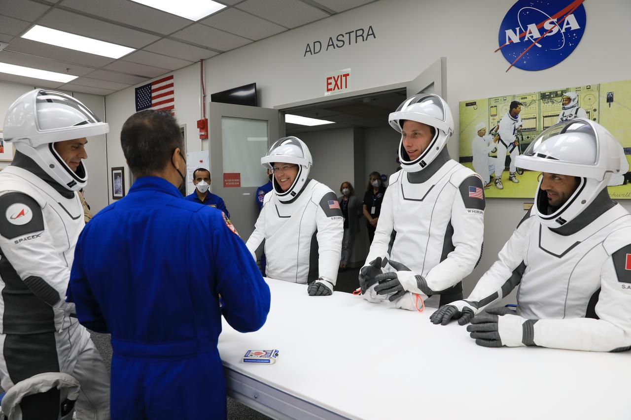 After suit-up and final fit checks, NASA’s SpaceX Crew-6 astronauts participate in a traditional game of cards inside the Neil Armstrong Operations and Checkout Building at NASA’s Kennedy Space Center crew in Florida on Feb. 26, 2023. At far left is Andrei Fedyaev, Roscosmos cosmonaut and mission specialist. On the opposite side of the table, from left are NASA astronaut Stephen Bowen, spacecraft commander; NASA astronaut Warren “Woody” Hoburg, pilot; and Sultan Alneyadi, UAE (United Arab Emirates) astronaut and mission specialist. The crewmembers are preparing for launch to the International Space Station aboard SpaceX’s Dragon spacecraft atop the Falcon 9 rocket. Launch was targeted for 1:45 a.m. EST on Feb. 27 from Launch Complex 39A, but was scrubbed for the day. Crew-6 is the sixth crew rotation mission with SpaceX to the station, and the seventh flight of Dragon with people as part of the agency’s Commercial Crew Program. 