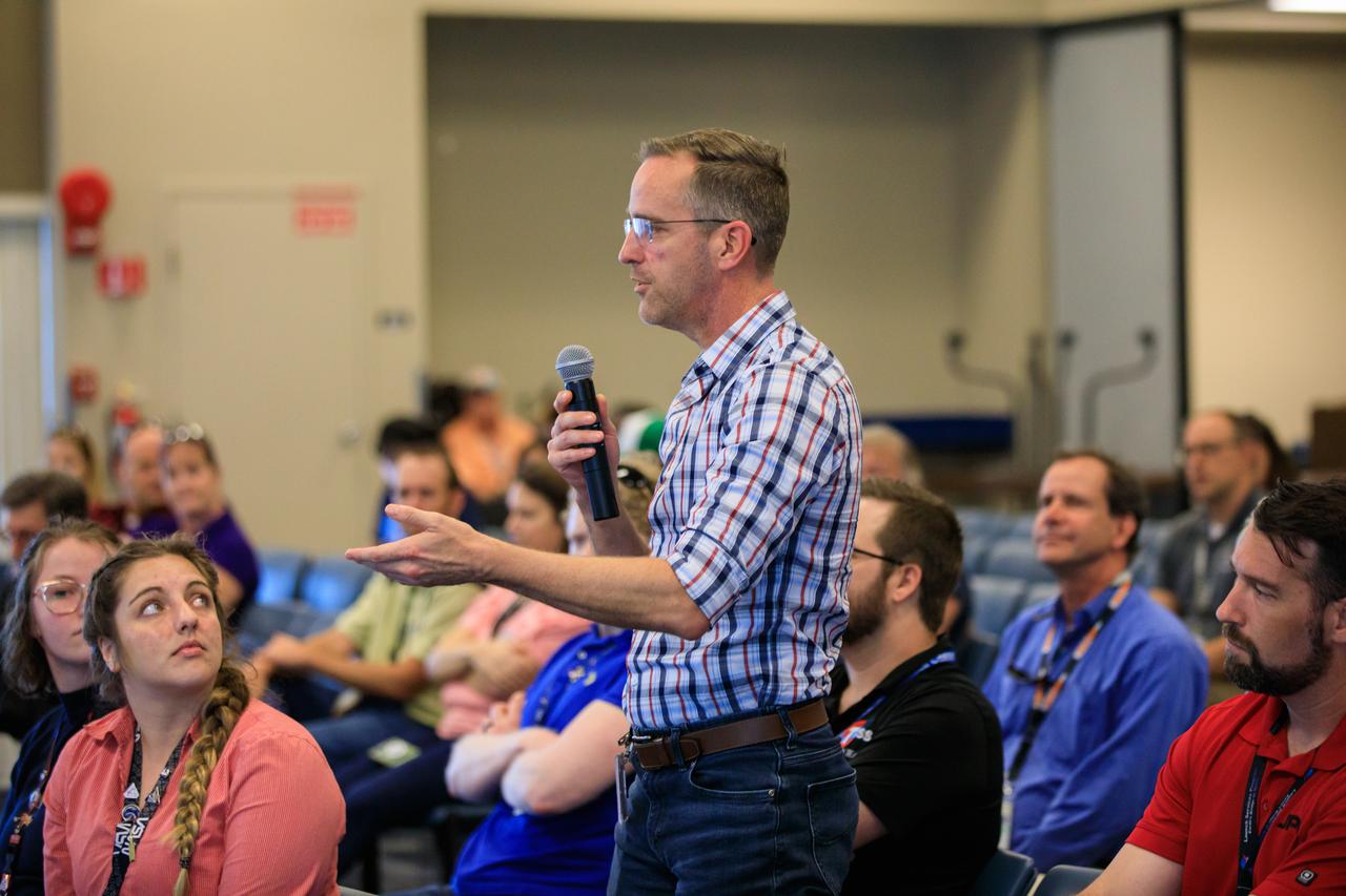 An audience member asks a question during the inaugural Cross-Program Connection event at NASA Kennedy Space Center’s Space Station Processing Facility on March 8, 2023. Arthur Muir, a retired Chicago attorney and America’s oldest Mt. Everest summiteer, was the speaker at the Florida spaceport function titled “Explorers Doing the Impossible.” He toured Kennedy before sharing his experiences in overcoming incredible challenges during his journey to the top of Earth’s highest mountain.