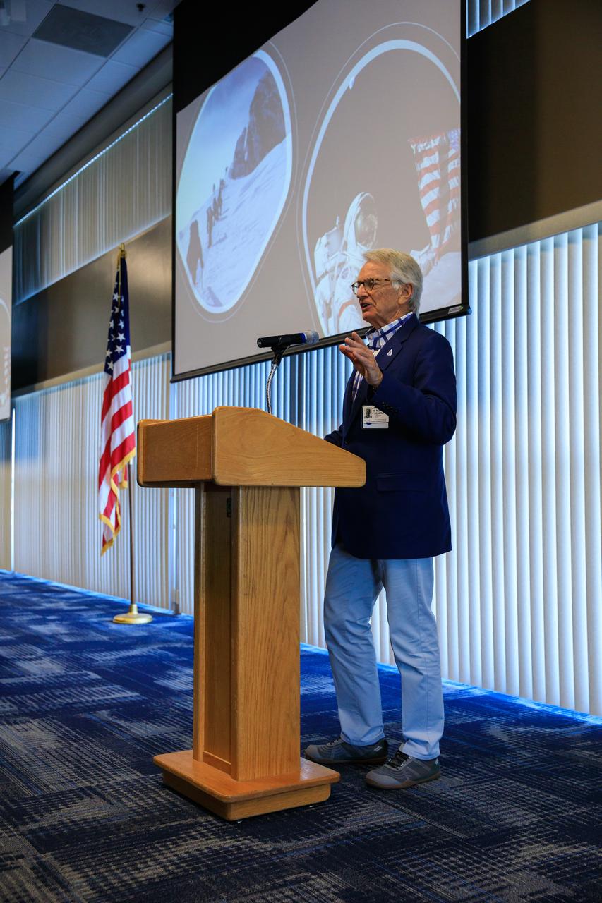 Arthur Muir, a retired Chicago attorney and America’s oldest Mt. Everest summiteer, addresses the audience during the inaugural Cross-Program Connection event at NASA Kennedy Space Center’s Space Station Processing Facility on March 8, 2023. Muir, 75, was the speaker at the Florida spaceport function titled “Explorers Doing the Impossible.” He toured Kennedy before sharing his experiences in overcoming incredible challenges during his journey to the top of Earth’s highest mountain.