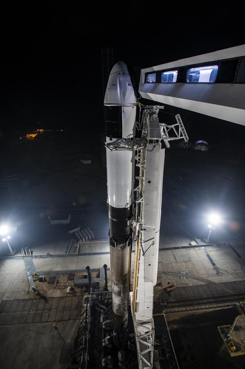 A SpaceX Falcon 9 rocket, with the company’s Dragon spacecraft atop, is secured in the vertical position at NASA Kennedy Space Center’s Launch Complex 39A on March 13, 2023, in preparation for the 27th commercial resupply services launch to the International Space Station. The mission will deliver new science investigations, supplies, and equipment to the crew aboard the space station, including the final two experiments comprising the National Institutes for Health and International Space Station National Laboratory’s Tissue Chips in Space initiative, Cardinal Heart 2.0 and Engineered Heart Tissues-2. Liftoff is scheduled for 8:30 p.m. EDT on Tuesday, March 14, from Kennedy’s Launch Complex 39A