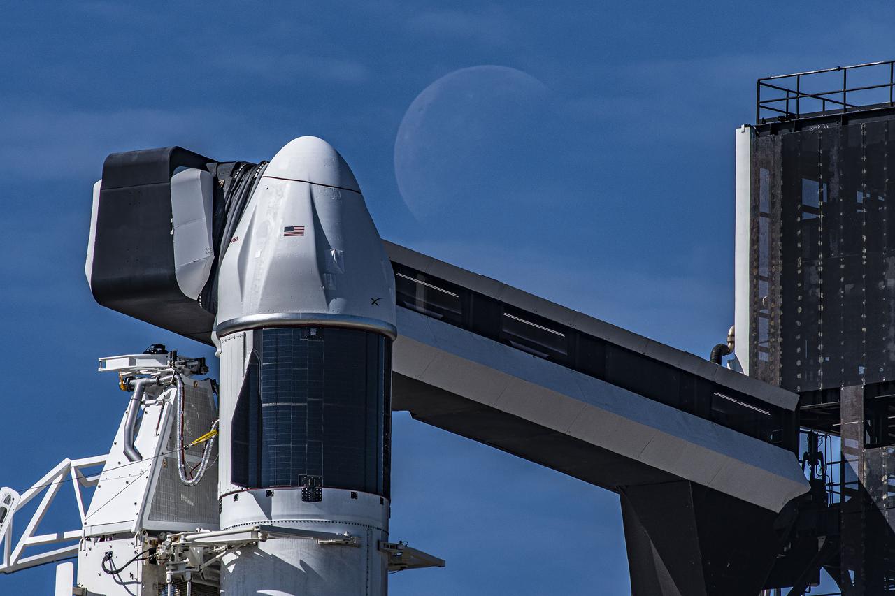 Seen here is a up-close view of the SpaceX Dragon spacecraft atop the company’s Falcon 9 rocket in the vertical position at NASA’s Kennedy Space Center in Florida on March 14, 2023, in preparation for the 27th commercial resupply services launch to the International Space Station. The mission will deliver new science investigations, supplies, and equipment to the crew aboard the space station, including the final two experiments comprising the National Institutes for Health and International Space Station National Laboratory’s Tissue Chips in Space initiative, Cardinal Heart 2.0 and Engineered Heart Tissues-2. Liftoff is scheduled for 8:30 p.m. EDT on Tuesday, March 14, from Kennedy’s Launch Complex 39A. 