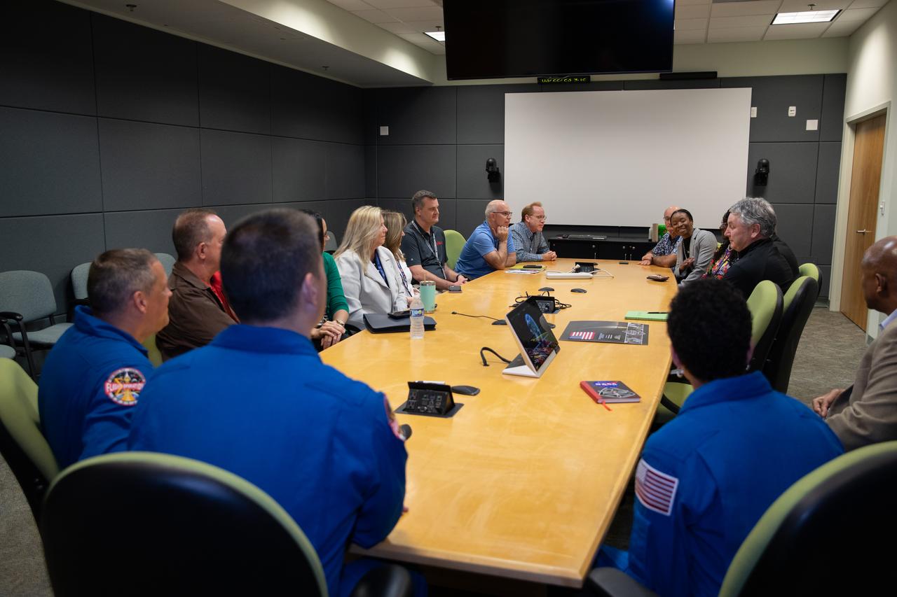 Three of NASA’s SpaceX Crew-4 crew members converse with Kennedy Space Center senior staff members inside the Florida spaceport’s Operations Support Building II on March 22, 2023. The crew members, from left, are NASA astronauts Bob Hines, Kjell Lindgren, and Jessica Watkins. Hines, Lindgren, and Watkins, along with ESA (European Space Agency) astronaut Samantha Cristoforetti, launched to the International Space Station aboard a SpaceX Crew Dragon spacecraft on April 27, 2022, for an approximately six-month science mission aboard the orbiting laboratory.