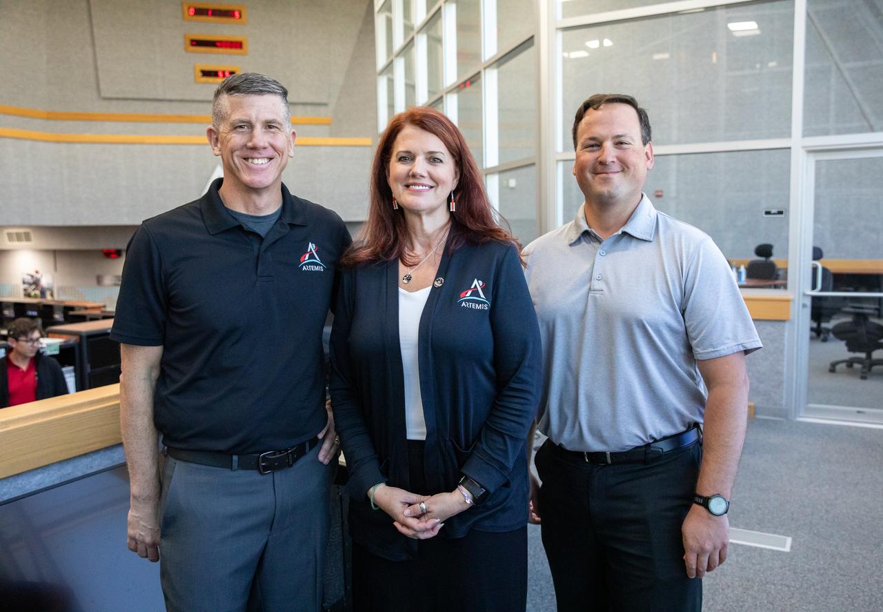 Artemis Launch Director Charlie Blackwell-Thompson, center, is inside Firing Room 1 of the Launch Control Center at NASA’s Kennedy Space Center in Florida during the inaugural Artemis I launch director awards and plaque ceremony on March 24, 2023. At left is Jeremy Graeber, Artemis assistant launch director. At right is Wes Mosedale, technical assistant to the launch director. Following tradition from the Apollo and Space Shuttle Programs, the Artemis I plaque was added to the wall in Firing Room 1 by Blackwell-Thompson. The first in a series of increasingly complex missions, Artemis I launched successfully from Kennedy’s Launch Pad 39B at 1:47 a.m. EST on Nov. 16, 2022. 