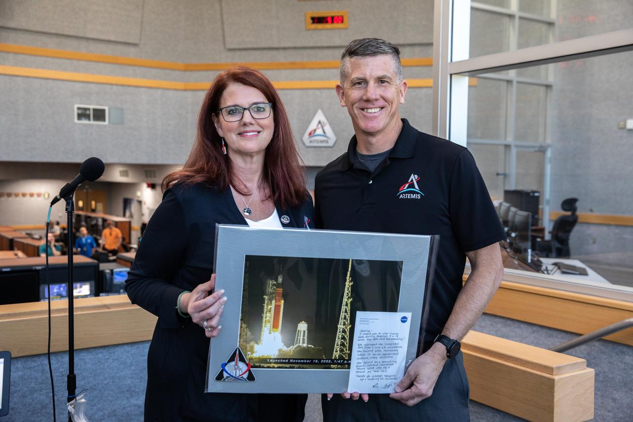Artemis Launch Director Charlie Blackwell-Thompson (left) acknowledged and honored members of the Artemis team during the inaugural Artemis Launch Director Awards, held March 24, 2023, inside Firing Room 1 of the Rocco A. Petrone Launch Control Center at NASA’s Kennedy Space Center in Florida. Award recipients included Assistant Launch Director Jeremy Graeber, who directly supports and assists Blackwell-Thompson during launch countdown operations. Artemis I launched successfully from Kennedy's Launch Pad 39B at 1:47 a.m. EST on Nov. 16, 2022.