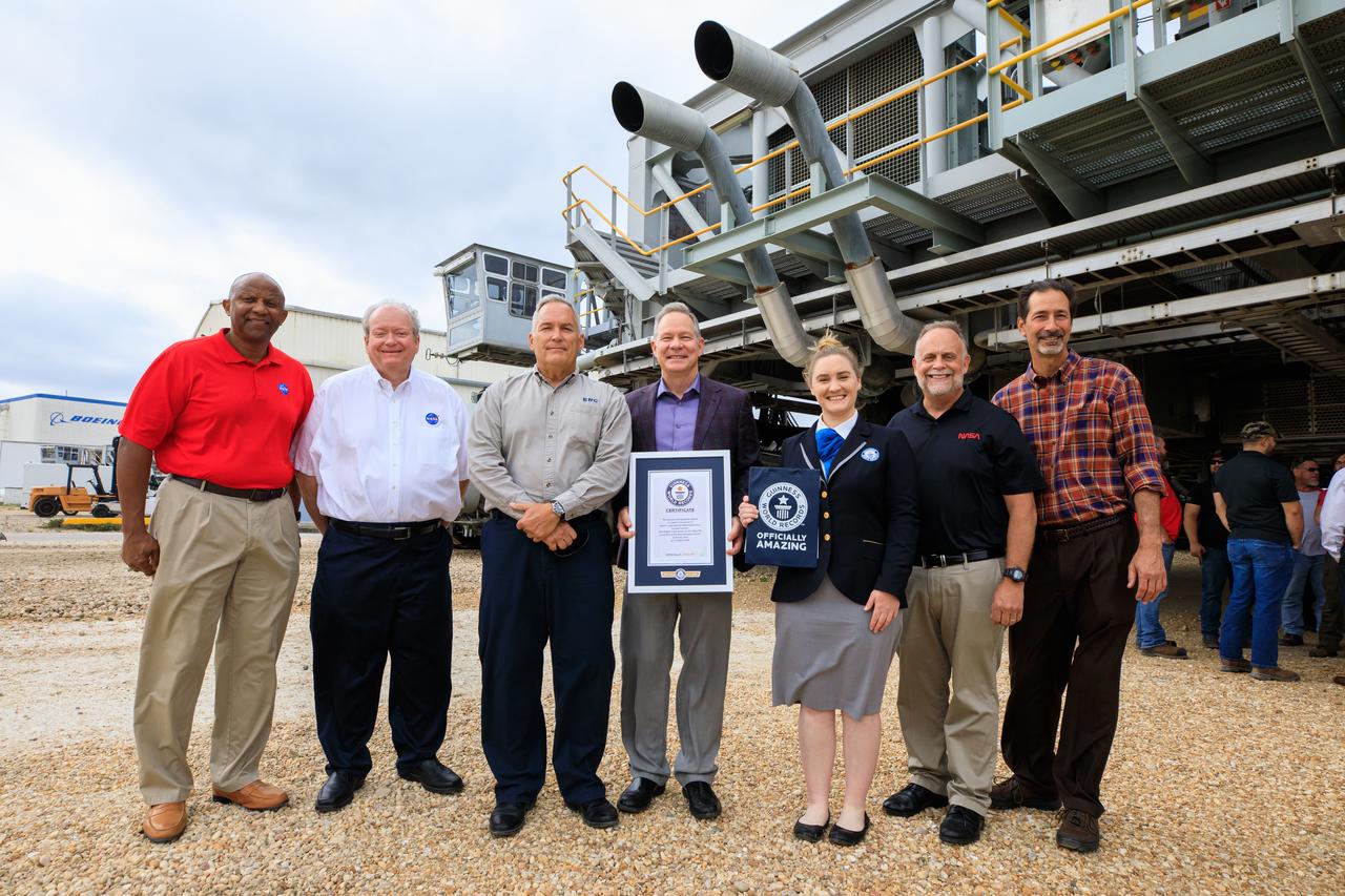Guinness World Records officially designated NASA’s Crawler Transporter 2 as the heaviest self-powered vehicle, weighing approximately 6.65 million pounds. During a March 29, 2023, ceremony at the agency's Kennedy Space Center in Florida, Guinness World Records presented a certificate to teams with the Exploration Ground Systems Program and Kennedy leadership. Pictured, from left, are: Kelvin Manning, Kennedy deputy director; Burt Summerfield, Kennedy associate director, management; Brett Raulerson, Jacobs TOSC Crawlers, Transporters and Structures group manager; Gary Casteel, Jacobs director, Ground Systems Support; Hannah Ortman, Guinness World Records adjudicator; Shawn Quinn, NASA’s Exploration Ground Systems manager; and John Giles, NASA’s Crawler Element Operations manager.