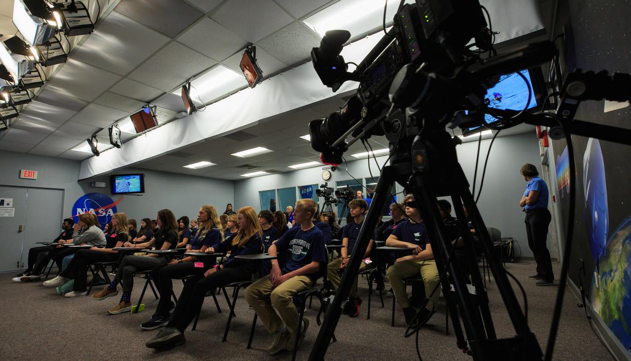 As part of NASA’s NextGen STEM project, students from Florida’s Montverde Academy, Storm Grove Middle School, and Whispering Pines School, as well as a homeschool collective from Georgia, participate in an environmentally focused Earth Day briefing inside the News Auditorium at NASA’s Kennedy Space Center in Florida on April 20, 2023. Along with the students participating in person, middle- and high-school students across the country had the opportunity to ask questions of the panel via phone to discuss how technology and science coexist with nature at Kennedy.