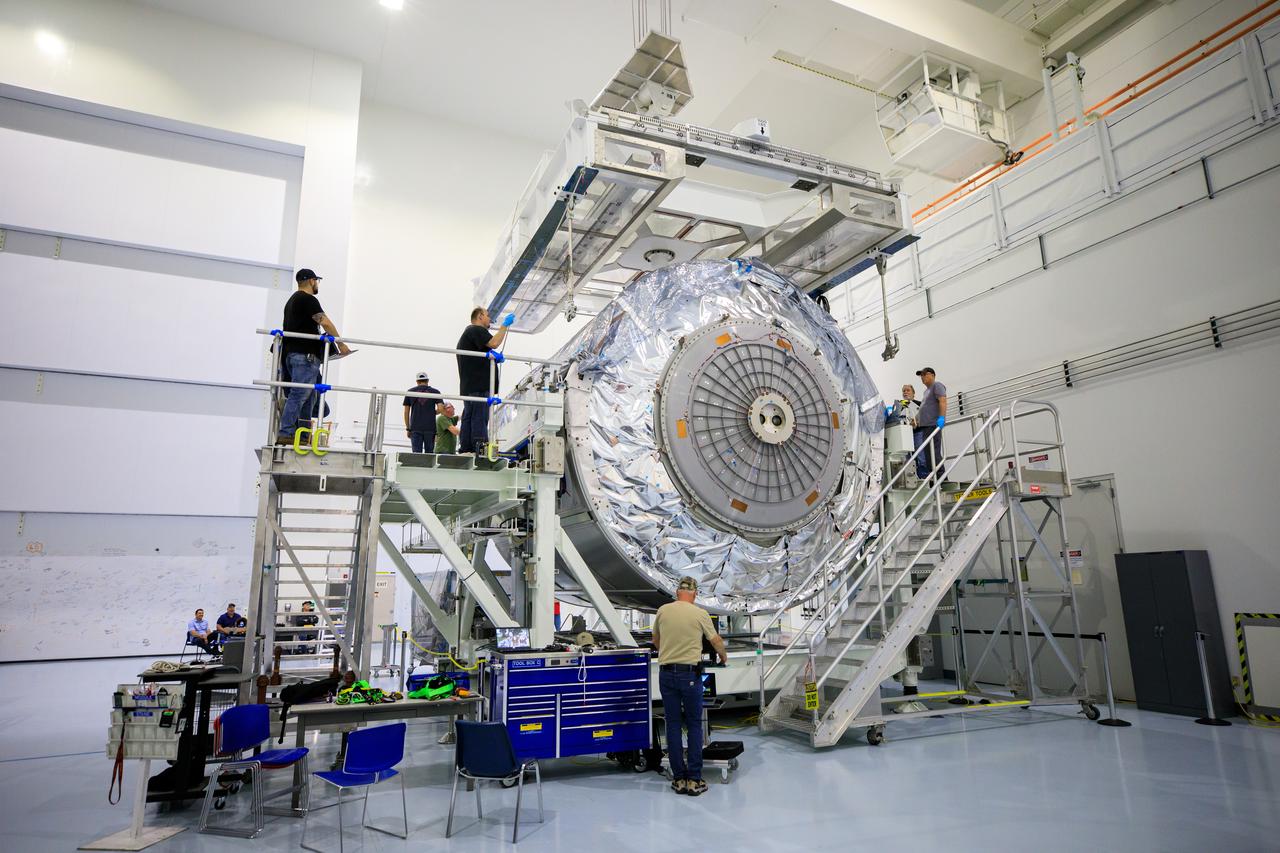 The Multi-Purpose Logistics Module (MPLM), used during the Space Shuttle Program to transfer cargo to and from the International Space Station, is lifted by crane inside the Space Station Processing Facility high bay at NASA’s Kennedy Space Center in Florida on April 20, 2023. The MPLM is being prepared for transport to Ellington Field in Houston, where it will then be transported by road to Axiom’s facility near Ellington to be utilized to further commercialization of space. Three MPLMs were built by Thales Alenia Space Italia (TASI) for the Italian Space Agency (ASI) and named after Italian masters (Leonardo, Raffaello, and Donatello). Only two ever flew to the space station, Leonardo and Raffaello, with Axiom intending to use Raffaello as a future element that will attach to a segment being built by the company for addition to the space station. 