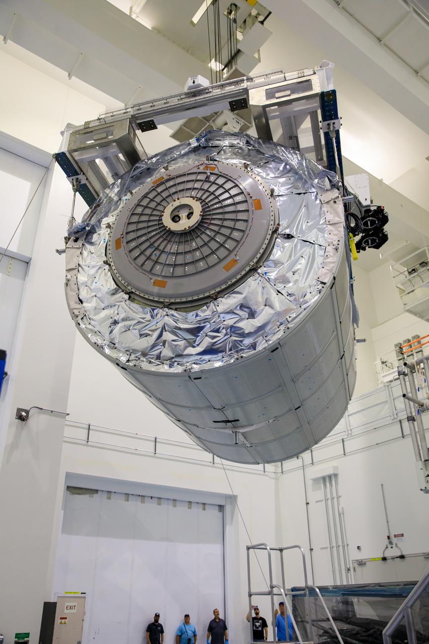 The Multi-Purpose Logistics Module (MPLM), used during the Space Shuttle Program to transfer cargo to and from the International Space Station, is moved by crane inside the Space Station Processing Facility high bay at NASA’s Kennedy Space Center in Florida on April 20, 2023. The MPLM is being prepared for transport to Ellington Field in Houston, where it will then be transported by road to Axiom’s facility near Ellington to be utilized to further commercialization of space. Three MPLMs were built by Thales Alenia Space Italia (TASI) for the Italian Space Agency (ASI) and named after Italian masters (Leonardo, Raffaello, and Donatello). Only two ever flew to the space station, Leonardo and Raffaello, with Axiom intending to use Raffaello as a future element that will attach to a segment being built by the company for addition to the space station. 