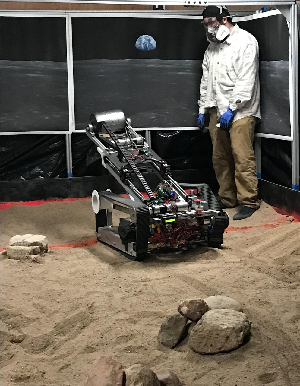 The New Mexico College of Mining and Technology robotic miner takes its first dig in the school’s mining arena. More than 40 teams from around the U.S. participated in NASA’s Lunabotics competition, which challenges collegiate teams to design and built remote-controlled robots under constraints similar to those the agency will face as it returns to the lunar surface through Artemis. The objective of the challenge is to see which team’s robot can collect and deposit the most rocky regolith within a specified amount of time.