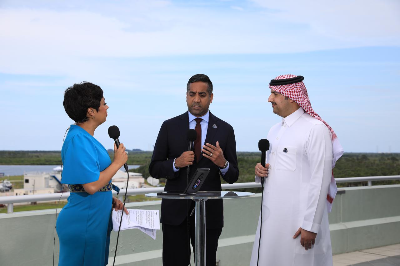 From left, Director of Digital Strategy for Axiom Space Sonya Gavankar McKay interviews Axiom Space Chief Revenue Officer Tejpaul Bhatia and Chief Development and Planning Officer of the Saudi Space Commission Ahmed Al-Ghofaili during a live broadcast ahead of the Axiom Mission 2 (Ax-2) launch from NASA’s Kennedy Space Center in Florida on May 21, 2023. Ax-2 is the second all private astronaut mission to the International Space Station, sending Commander Peggy Whitson, Pilot John Shoffner, and Mission Specialists Ali Alqarni and Rayyanah Barnawi to the orbiting laboratory, where they will spend about 10 days conducting scientific research, outreach, and commercial activities. Liftoff occurred at 5:37 p.m. EDT from Kennedy’s Launch Complex 39A.