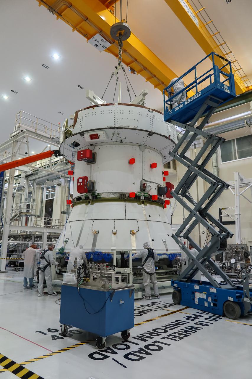 Preparations are underway to lift the European Service Module (ESM) for NASA’s Artemis II mission by crane inside the high bay of the Neil A. Armstrong Operations and Checkout Building at NASA’s Kennedy Space Center in Florida on May 22, 2023. Teams from NASA and Lockheed Martin are preparing the service module for transfer to the FAST (final assembly and system testing) cell for final checkouts before it is stacked with the Orion crew module. The powerhouse that will fuel and propel Orion in space, the ESM will be used for Artemis II, the first Artemis mission flying crew aboard Orion.