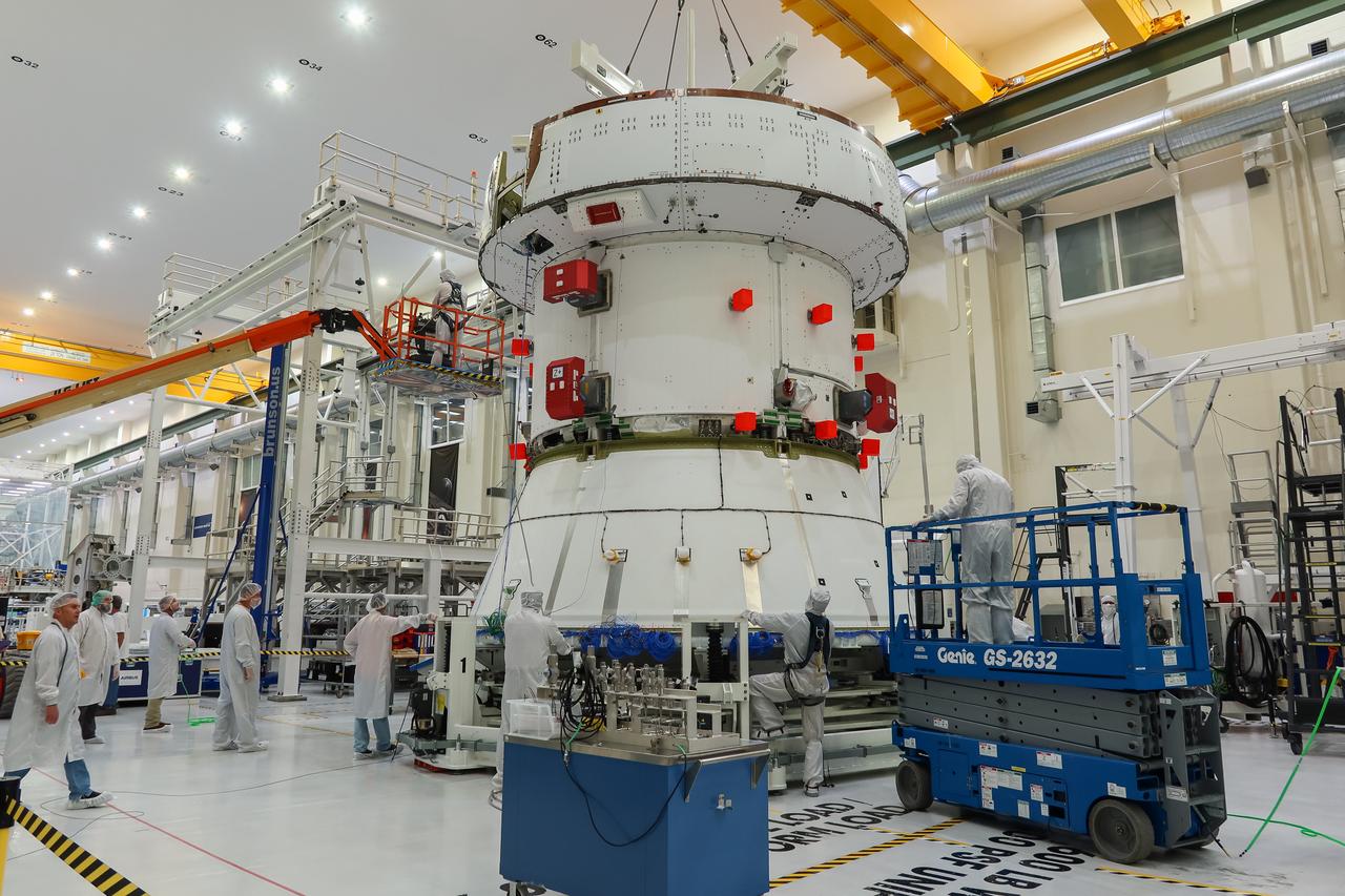 Preparations are underway to lift the European Service Module (ESM) for NASA’s Artemis II mission by crane inside the high bay of the Neil A. Armstrong Operations and Checkout Building at NASA’s Kennedy Space Center in Florida on May 22, 2023. Teams from NASA and Lockheed Martin are preparing the service module for transfer to the FAST (final assembly and system testing) cell for final checkouts before it is stacked with Orion crew module. The powerhouse that will fuel and propel Orion in space, the ESM will be used for Artemis II, the first Artemis mission flying crew aboard Orion. 