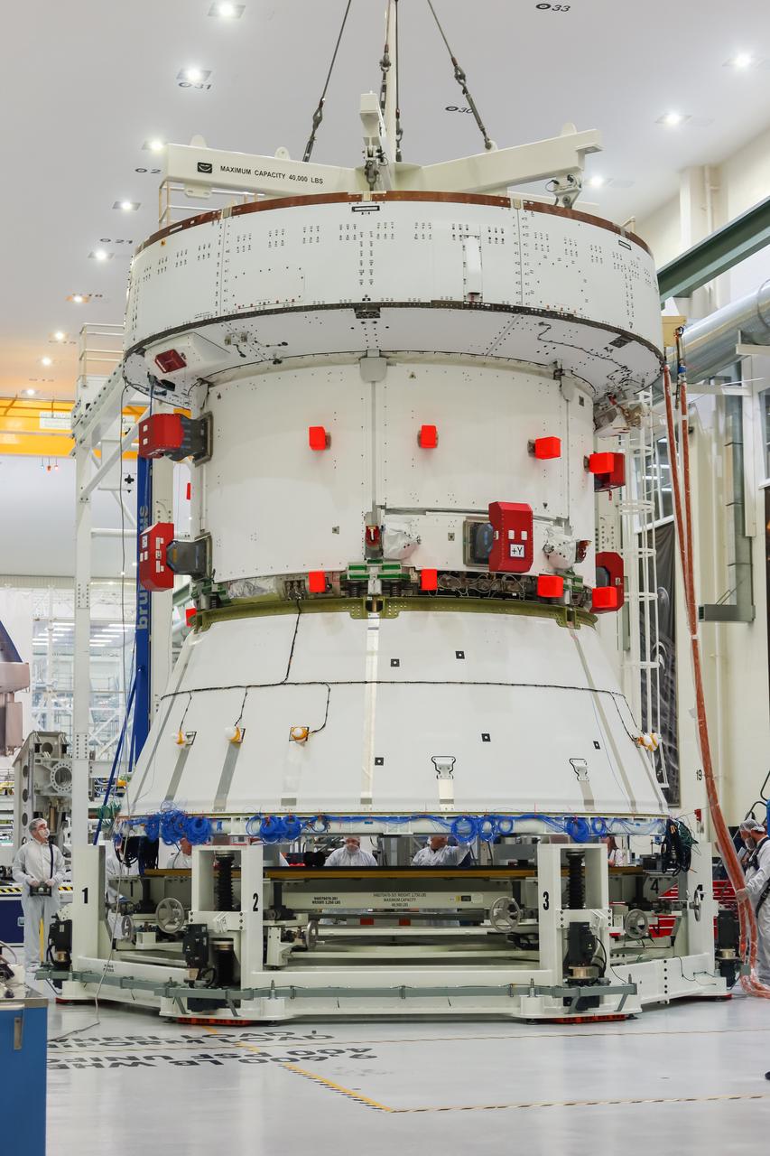 The European Service Module (ESM) for NASA’s Artemis II mission is lifted by crane inside the high bay of the Neil A. Armstrong Operations and Checkout Building at NASA’s Kennedy Space Center in Florida on May 22, 2023. Teams from NASA and Lockheed Martin are preparing the service module for transfer to the FAST (final assembly and system testing) cell for final checkouts before it is stacked with the Orion crew module. The powerhouse that will fuel and propel Orion in space, the ESM will be used for Artemis II, the first Artemis mission flying crew aboard Orion. 