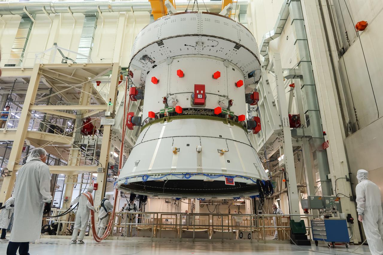 The European Service Module (ESM) for NASA’s Artemis II mission arrives at the Final Assembly and System Testing (FAST) cell inside the high bay of the Neil A. Armstrong Operations and Checkout Building at NASA’s Kennedy Space Center in Florida on May 22, 2023. Teams from NASA and Lockheed Martin are transferring the service module to the FAST (final assembly and system testing) cell for final checkouts before it is stacked with the Orion crew module.. The powerhouse that will fuel and propel Orion in space, the ESM will be used for Artemis II, the first Artemis mission flying crew aboard Orion. 