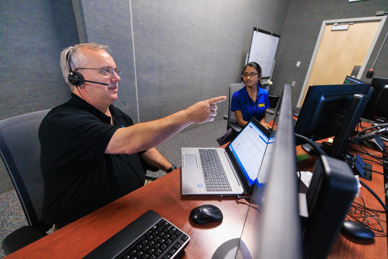 Jim Kania (left), Mass Spectrometer Observing Lunar Operations (MSOLO) software engineering lead, and Pri Johnson, MSOLO systems engineer, participate in simulation training at NASA’s Kennedy Space Center in Florida on May 25, 2023, in preparation for the agency’s Volatile Investigating Polar Exploration Rover (VIPER) mission. The purpose of the training was to get the integrated VIPER team – a mix of engineers from Kennedy and NASA’s Ames Research Center in California – accustomed to operating together during phases of the mission where the rover will be driving. MSOLO is a modified commercial off-the-shelf mass spectrometer that will help the agency analyze the chemical makeup of landing sites on the Moon and study water on the lunar surface. MSOLO, as part of VIPER, is scheduled to launch on a SpaceX Falcon Heavy rocket through NASA’s Commercial Lunar Payload Delivery Service (CLPS) initiative in late 2024, landing at the Moon’s South Pole aboard Astrobotic’s Griffin lander. Through Artemis missions, CLPS deliveries will be used to perform science experiments, test technologies, and demonstrate capabilities to help NASA explore the Moon and prepare for human deep space exploration missions.