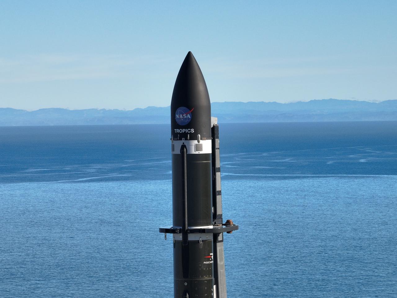 A Rocket Lab Electron rocket stands on Pad B, Launch Complex 1, in Māhia, New Zealand, just ahead of liftoff at 3:46 p.m. NZST Friday, May 26, with NASA’s Time-Resolved Observations of Precipitation structure and storm Intensity with a Constellation of Smallsats (TROPICS) CubeSats secured in the payload fairing atop the rocket. The successful launch placed the final pair of TROPICS CubeSats into orbit, completing the constellation. TROPICS will provide data on temperature, precipitation, water vapor, and clouds by measuring microwave frequencies, providing insight into storm formation and intensification.