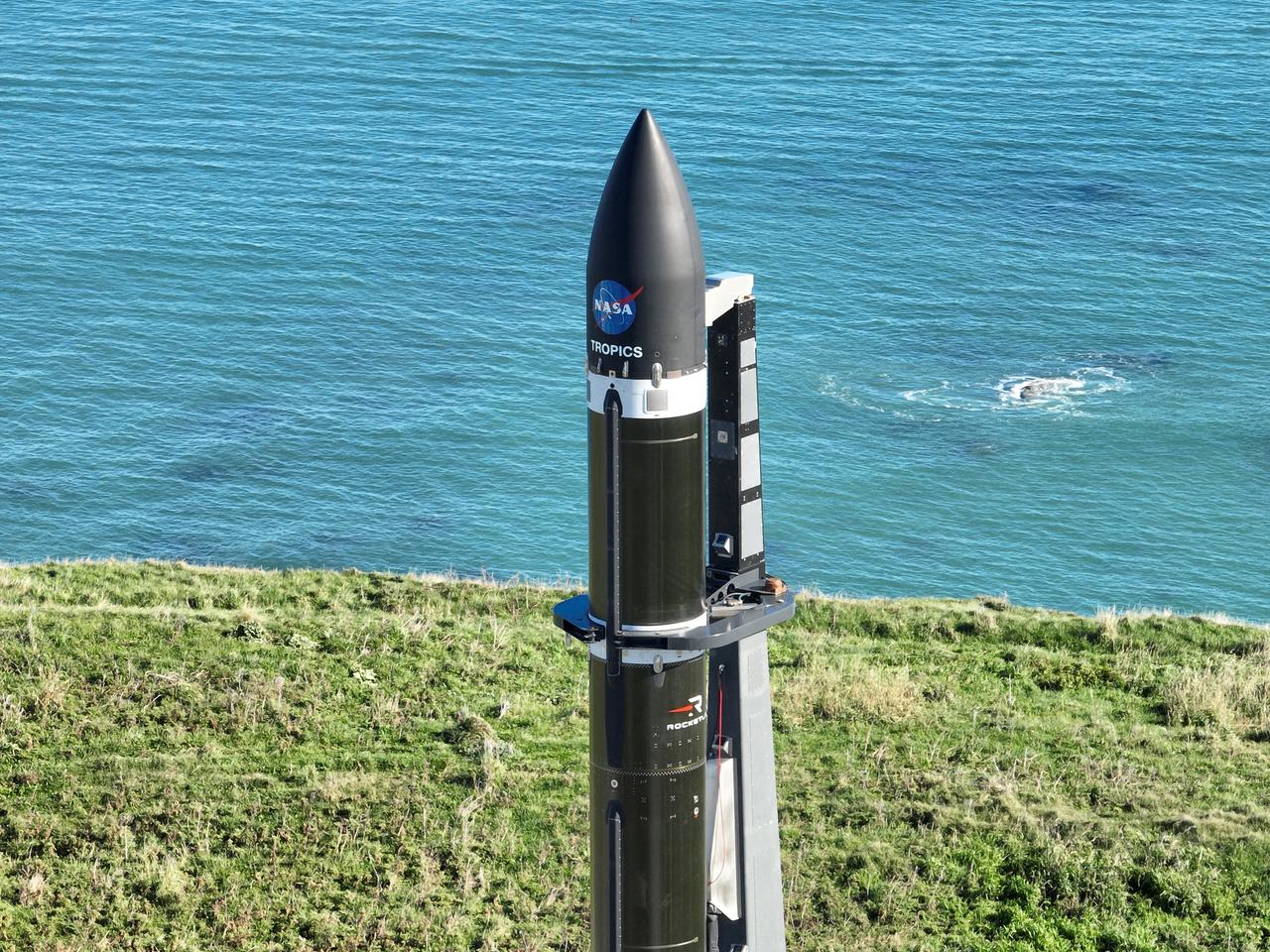 A Rocket Lab Electron rocket stands on Pad B, Launch Complex 1, in Māhia, New Zealand, just ahead of liftoff at 3:46 p.m. NZST Friday, May 26, with NASA’s Time-Resolved Observations of Precipitation structure and storm Intensity with a Constellation of Smallsats (TROPICS) CubeSats secured in the payload fairing atop the rocket. The successful launch placed the final pair of TROPICS CubeSats into orbit, completing the constellation. TROPICS will provide data on temperature, precipitation, water vapor, and clouds by measuring microwave frequencies, providing insight into storm formation and intensification.